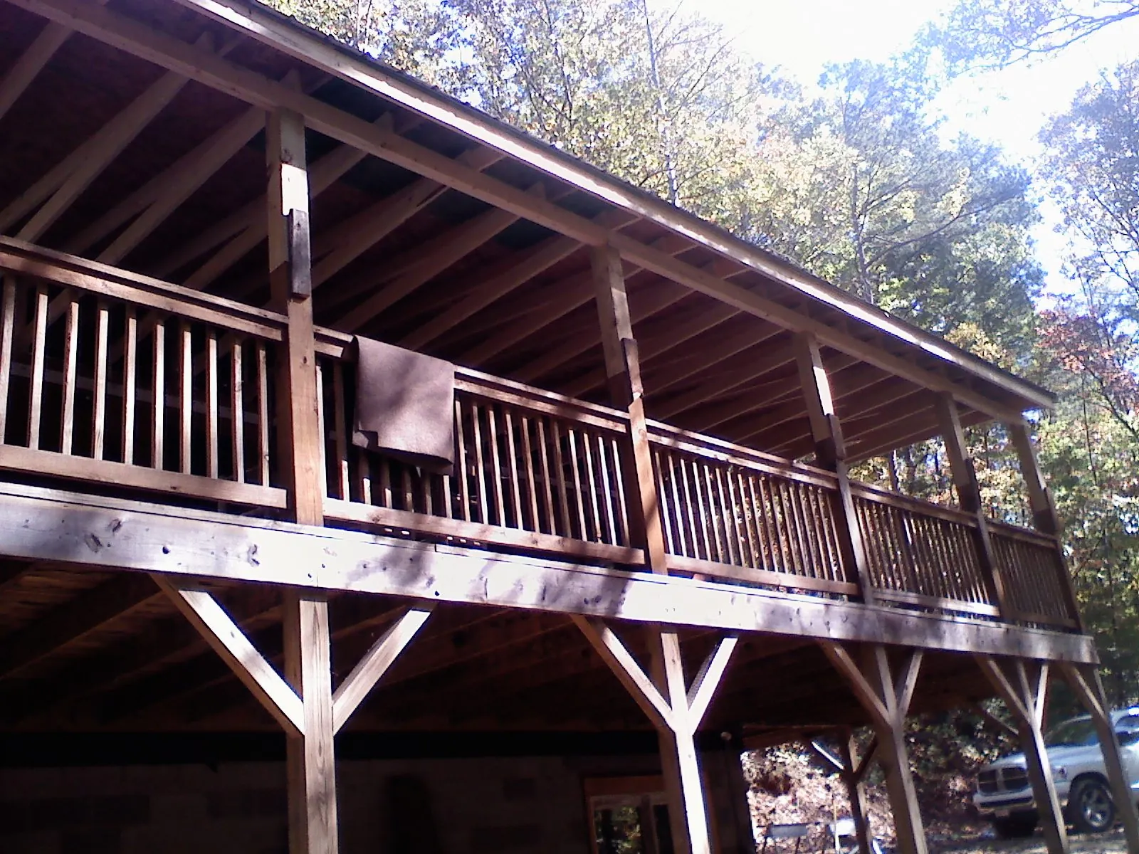 Timber framing under a new elevated porch and deck — Roof Leak Repair in Seeley Lake by Roofing Brothers